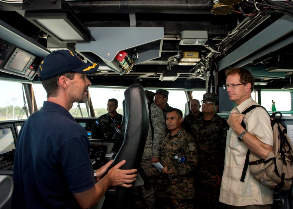 Capt. Douglas Casavant, left, the civil service master of the joint high speed vessel USNS Spearhead (JHSV 1), speaks to U.S. Ambassador to Honduras James D. Nealon, right, during a tour of the ship in Puerto 140901-N-QY430-193