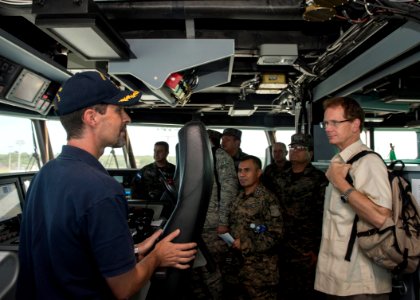 Capt. Douglas Casavant, left, the civil service master of the joint high speed vessel USNS Spearhead (JHSV 1), speaks to U.S. Ambassador to Honduras James D. Nealon, right, during a tour of the ship in Puerto 140901-N-QY430-193