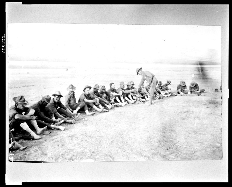 Capt. Napier inspecting feet of soldiers after days hike near San Antonio. Mexican-U.S. campaign after Villa LCCN2009630842
