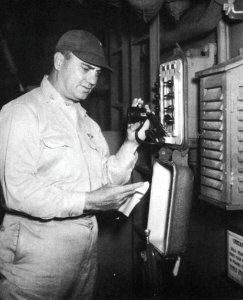 Captain Jackson R. Tate, USN, announces the surrender of Japan aboard the aircraft carrier USS Randolph (CV-15) on 15 August 1945