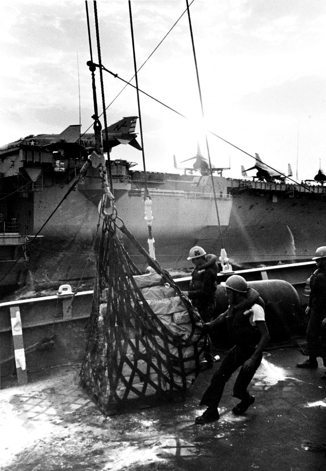 Cargo net is readied aboard USS Procyon (AF-61) in the South China Sea, April 1969 (USN 1137953)