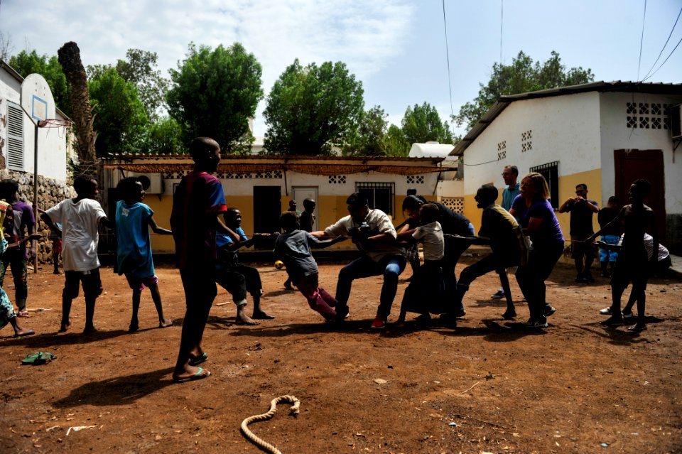Caritas volunteer group 130817-N-LE393-226