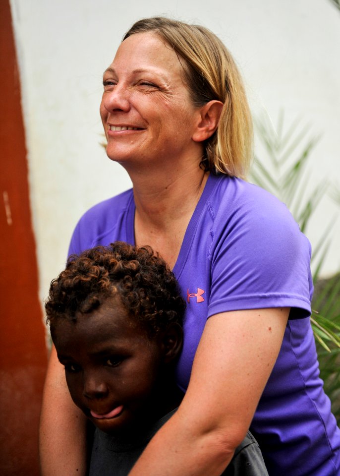 Caritas volunteer group 130817-N-LE393-468