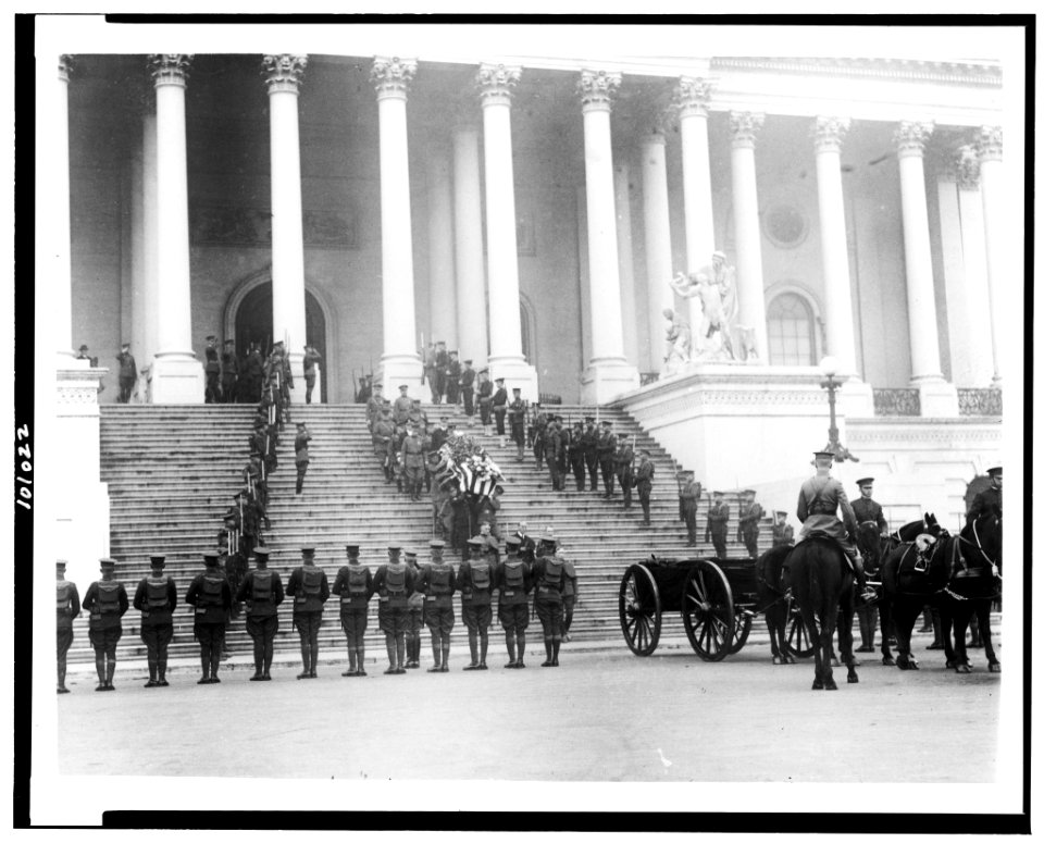 Coffin of the Unknown Soldier being brought down steps of the U.S. Capitol, where horse-drawn wagon awaits; military personnal stand at attention) - National Photo Co., Washington, D.C LCCN90709528