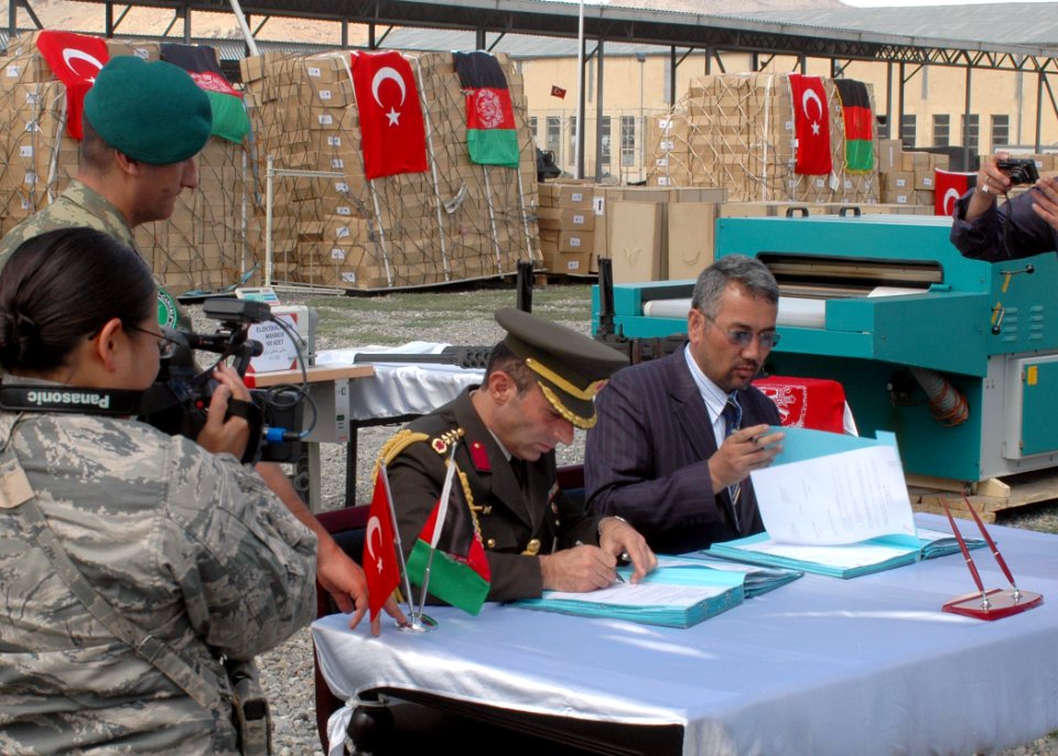 Col. Can Bolat and Col. Qussimi, Assistant to Minister Jawhari sign documents (4699289657)