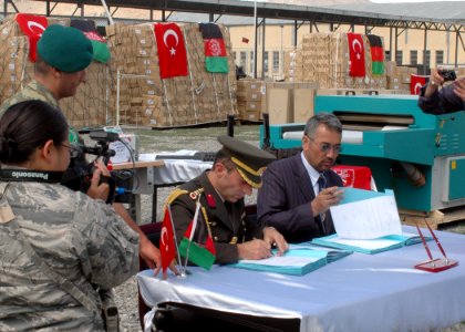 Col. Can Bolat and Col. Qussimi, Assistant to Minister Jawhari sign documents (4699289657)