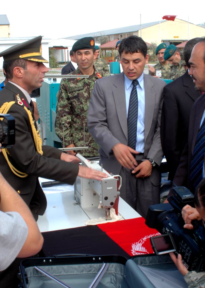 Col. Can Bolat explains to Minister Baz Mohammed Jawhari the type of sewing machines that have been donated (4699296527)