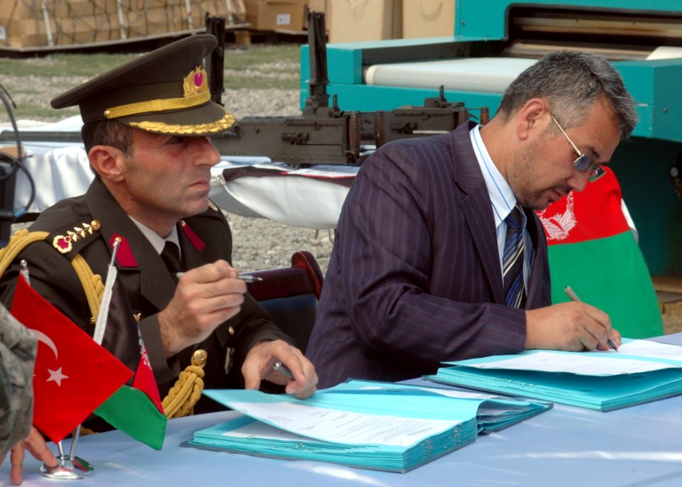 Col. Can Bolat and Col. Qussimi, Assistant to Minister Jawhari sign documents (4699293195)