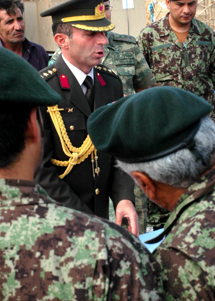 Col. Can Bolat explains to Afghan leaders some of the supplies that were donated (4699930886)