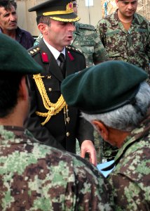 Col. Can Bolat explains to Afghan leaders some of the supplies that were donated (4699930886)