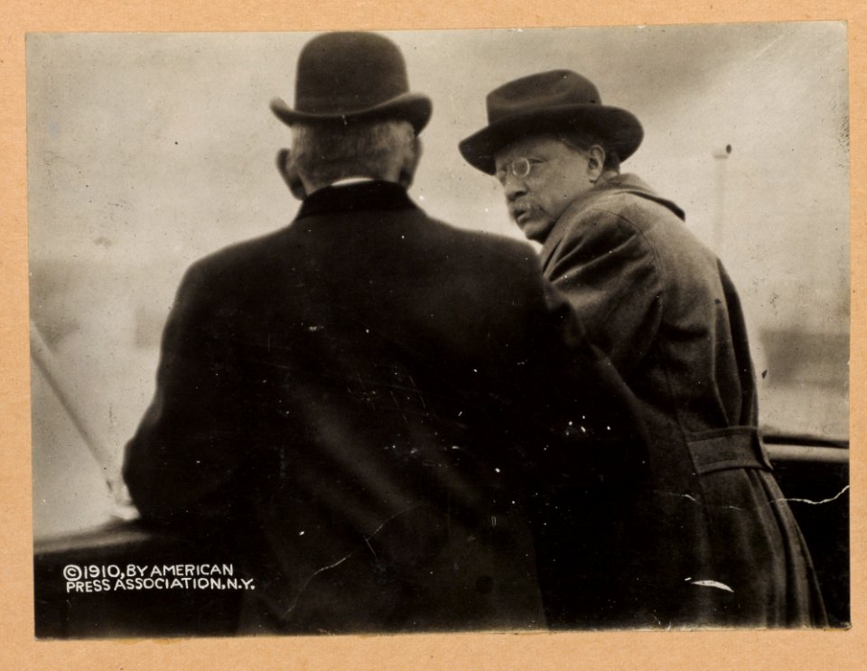 Col. Roosevelt on bridge of Queen Maud during voyage from Elsimore to Copenhagen, talking with Richelieu, head of merchant marine of Norway LCCN2013647448