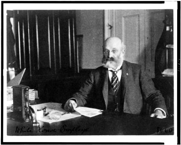 Col. William H. Crook, a White House employee, half-length portrait, seated at desk, facing left LCCN91482337