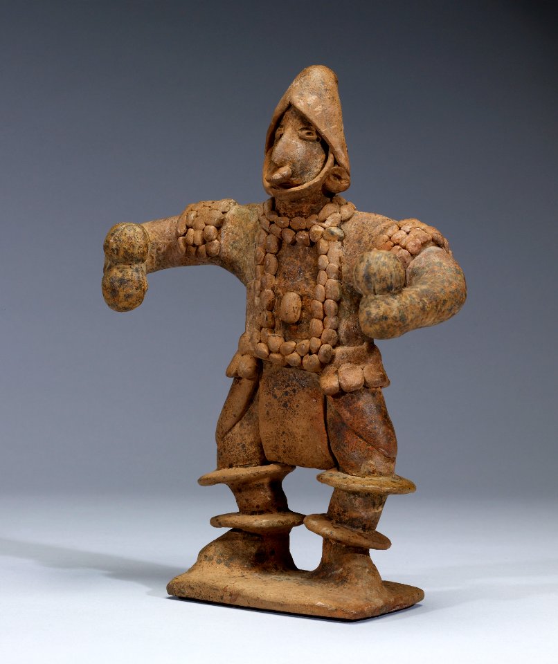Colima - Standing Figure with Elaborate Costume Holding Rattles - Walters 482808 - Three Quarter
