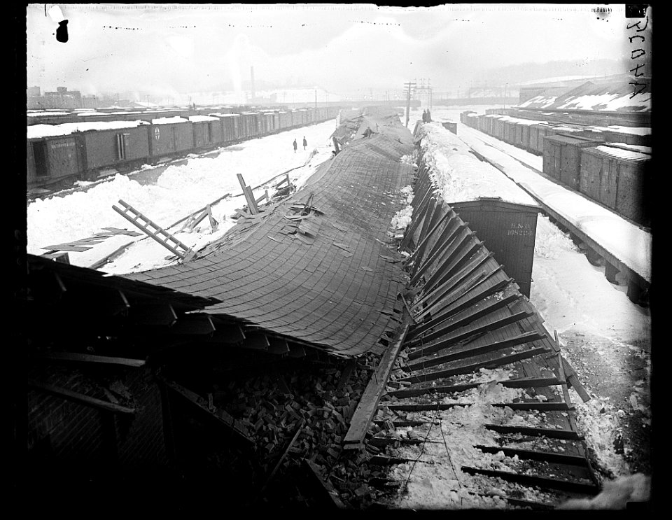 Collapsed roof at train yard with snow LCCN2016891200