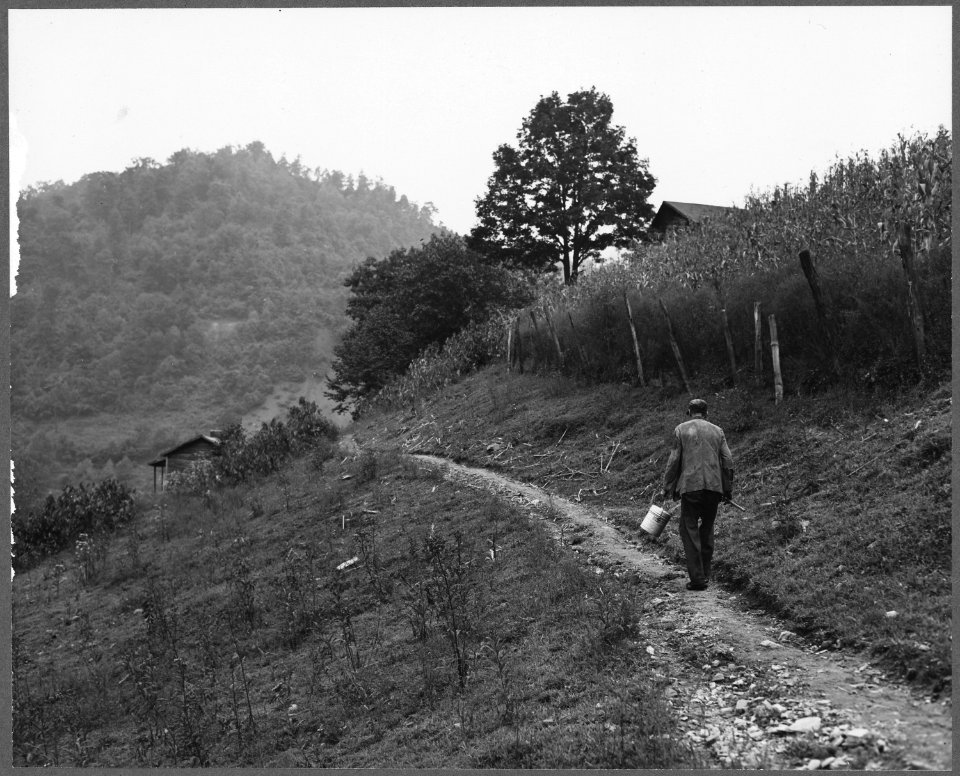 Blaine Sergent, coal loader, on his way home after work. P V & K Coal Company, Clover Gap Mine, Lejunior, Harlan... - NARA - 541286