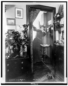 Blanche Bates, full-length portrait, standing, facing right, on telephone LCCN94508615