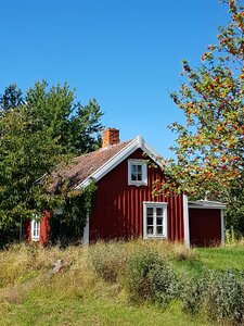 Red house with white trim september sweden photo