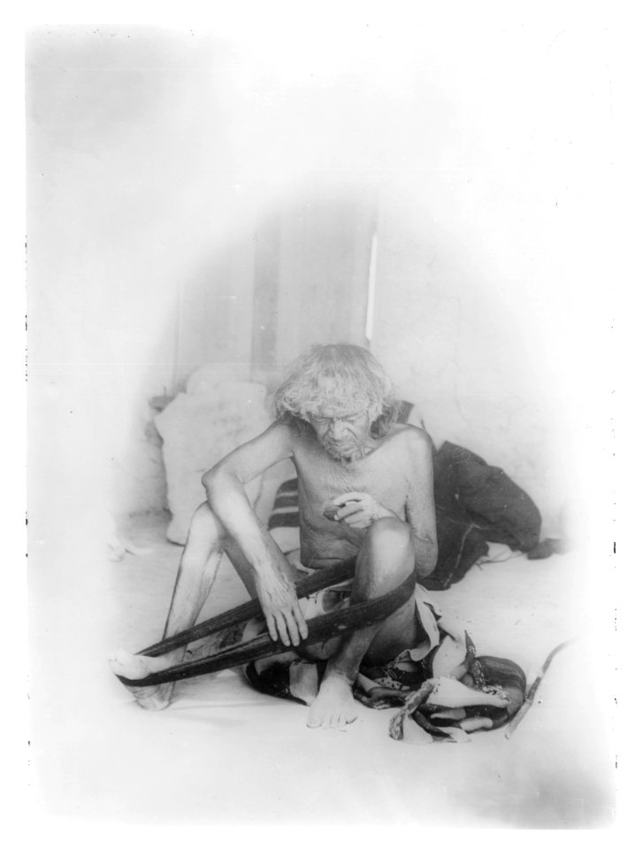 Blind Hopi Indian man winding yarn, ca.1900 (CHS-5037)