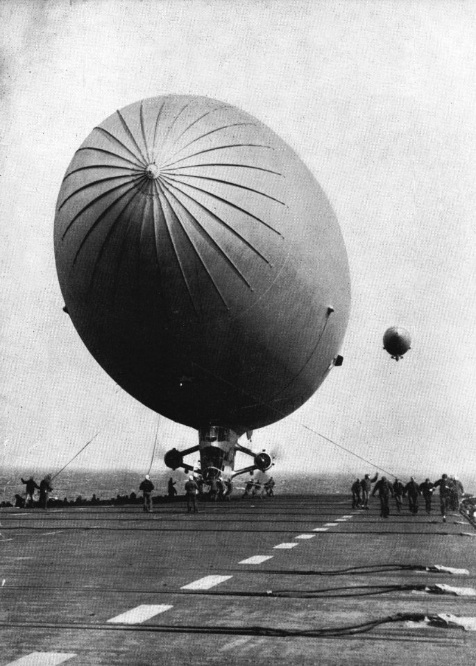 Blimp lands on USS Mindoro (CVE-120) c1950