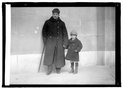 Blind Sen. Thos. D. Schall led by his 6 year old son LCCN2016821702