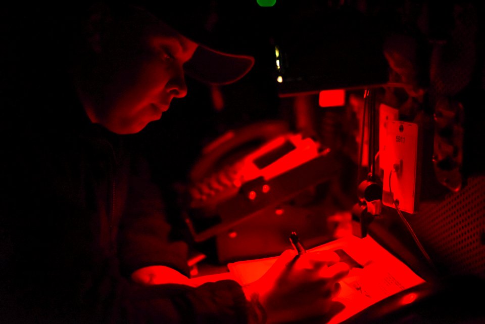 Boatswain’s Mate 2nd Class Cassandra Liriano, from Frederick, Md., writes in a deck log aboard the aircraft carrier USS Theodore Roosevelt (CVN-71) on May 11, 2019