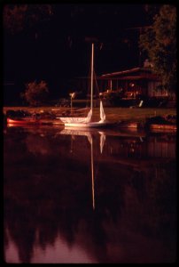 Boats-in-front-of-a-home-on-malibu-lake-in-the-santa-monica-mountains-near-malibu-california-which-is-located-on-the-northwestern-edge-of-los-angeles-county-may-1975 7159238746 o