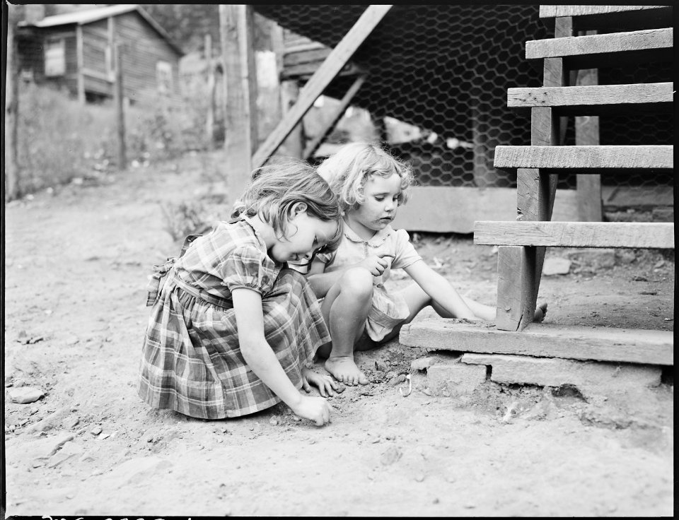 Bobbie Jean, right, playing near her front steps with a friend. P V & K Coal Company, Clover Gap Mine, Lejunior... - NARA - 541379