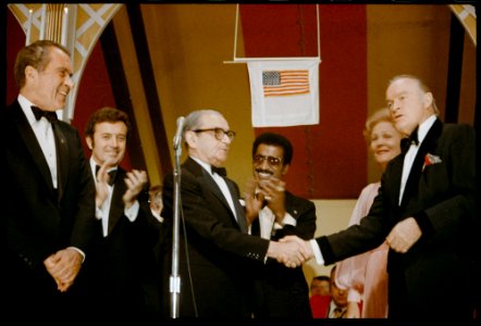 Bob Hope and Irving Berlin Shakes Hands on Stage at a White House Dinner Held in Honor of Returning Vietnam Prisoners of War