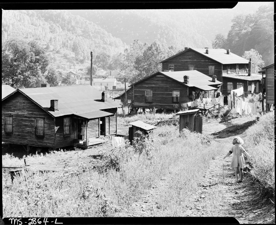 Bobbie Jean Sergent on the road below her house. P V & K Coal Company, Clover Gap Mine, Lejunior, Harlan County... - NARA - 541392
