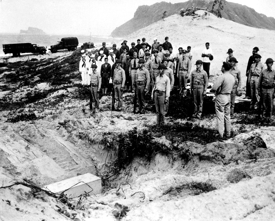 Body of Iida is buried with military honors by U.S. troops