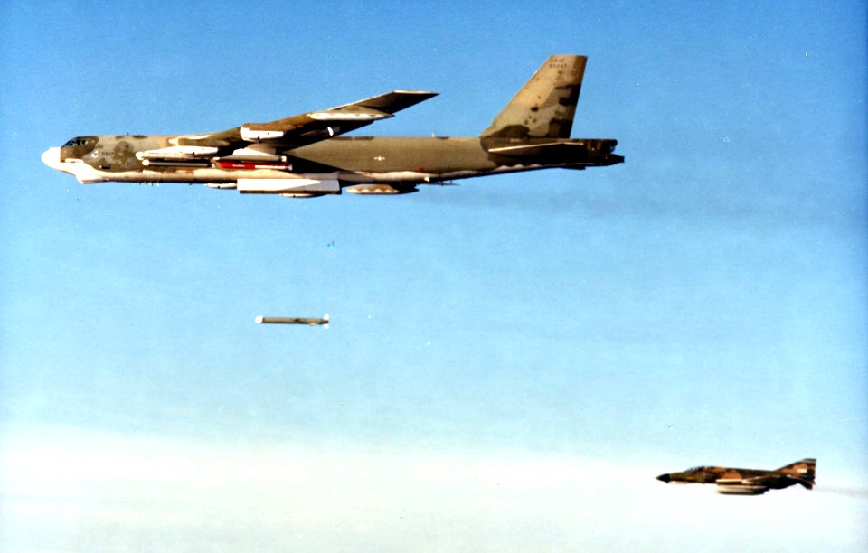 Boeing B-52G in flight dropping SRAM 061026-F-1234S-025