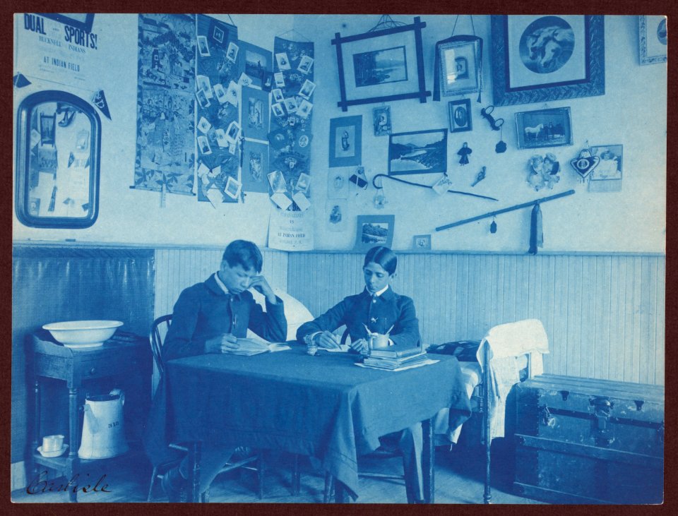 Carlisle Indian School, Carlisle, Pa. Two boys studying in dormitory room LCCN2008675519