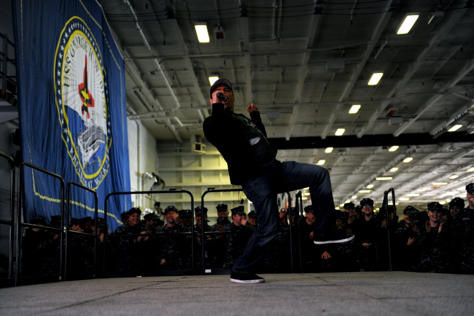 Carlos Mencia performs aboard USS George H.W. Bush. (8270225148)