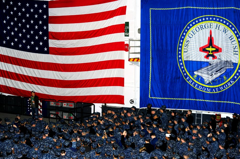 Carlos Mencia performs aboard USS George H.W. Bush. (8270224884)