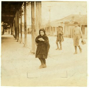 Carrie, a seven year old oyster shucker at Pass Packing Co., going home at 5-00 P.M. after a day beginning at 4-00 A.M., and spent shucking oysters and tending the baby. A common practice LOC nclc.00873