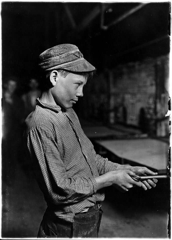 Carrying-in-boy- at the Lehr (15 years old). Has worked for several years. Works nine hours. Day shift one week... - NARA - 523091