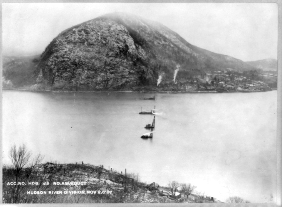 Catskill Aqueduct construction- Hudson River Crossing, looking west from Breakneck Mountain toward Storm King, showing borings being driven from scows, 1907 LCCN2003677462