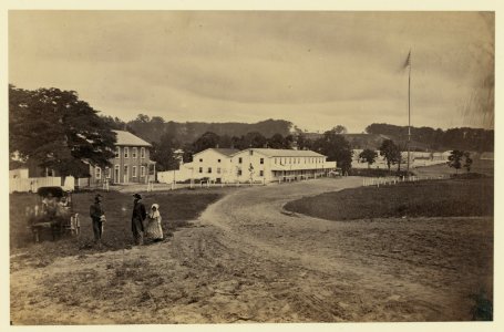 Cavalry depot at Giesboro, Md. Soldier facing man and girl with people in horse-drawn carriage in foreground LCCN91787364