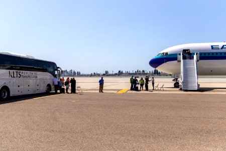 Celebrity Eclipse passengers disembark in San Diego to a jet waiting to take them to their home countries
