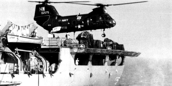 CH-46D Sea Knight of HC-6 hover over USS Concord (AFS-5) in July 1977