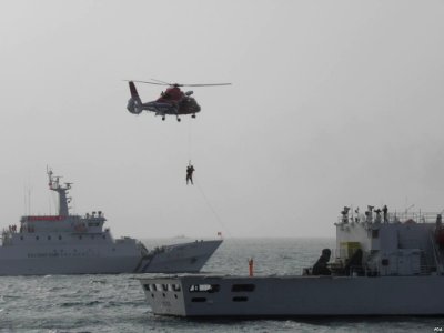 CGA patrol vessels and NASC helicopter outside of Port of Kaohsiung 20130330 photo
