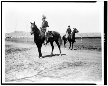 Colonel Carlton riding his horse, Chicken, with his orderly LCCN92512303