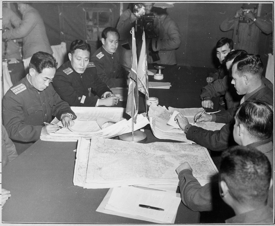 Colonel James Murray, Jr., USMC, and Colonel Chang Chun San, of the North Korean Communist Army, initial maps showing... - NARA - 520806