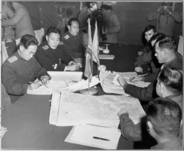 Colonel James Murray, Jr., USMC, and Colonel Chang Chun San, of the North Korean Communist Army, initial maps showing... - NARA - 520806