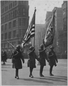 Color bearers of the famous 369th (African American) regiment at beginning of parade in honor of the . . . - NARA - 533537