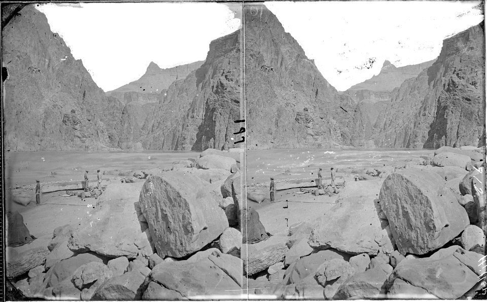 Colorado River. Grand Canyon, first granite gorge, repairing a boat, 1872. Upturned boat and all - NARA - 518011