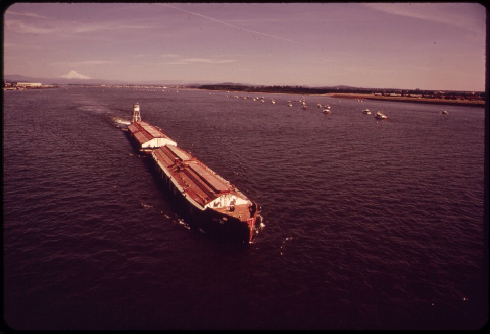Columbia-river-barge-and-a-flotilla-of-small-fishing-boats-mt-hood-is-in-the-background-051973 4271667305 o