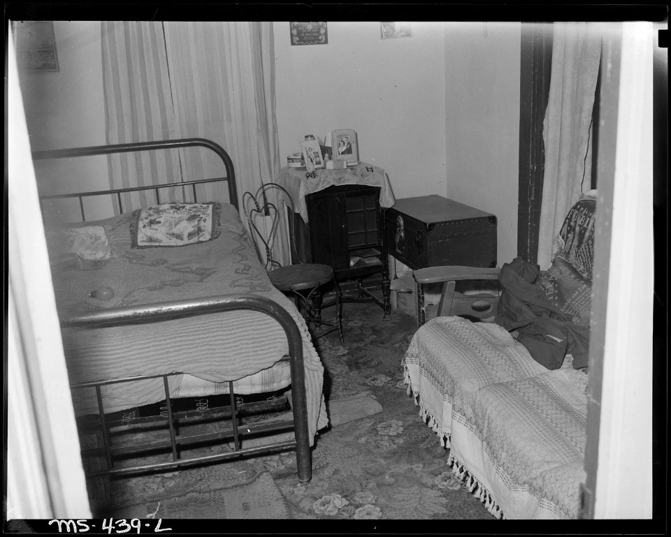 Combination living and bedroom of miner living in company housing project. Hi Heat Coal Company, Rains ^2 Mine... - NARA - 540412