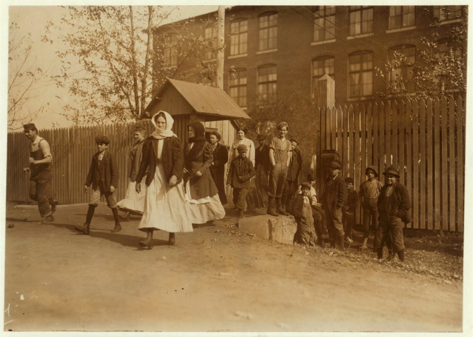Coming out at noon, Merrimac Mills. All workers, even the boys at the side of the gate. LOC cph.3a18652