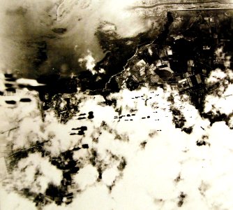 Bombs are dropped by a B-17 Flying Fortress on Cagliari airfield, Sardinia, 1942 (26683984363)